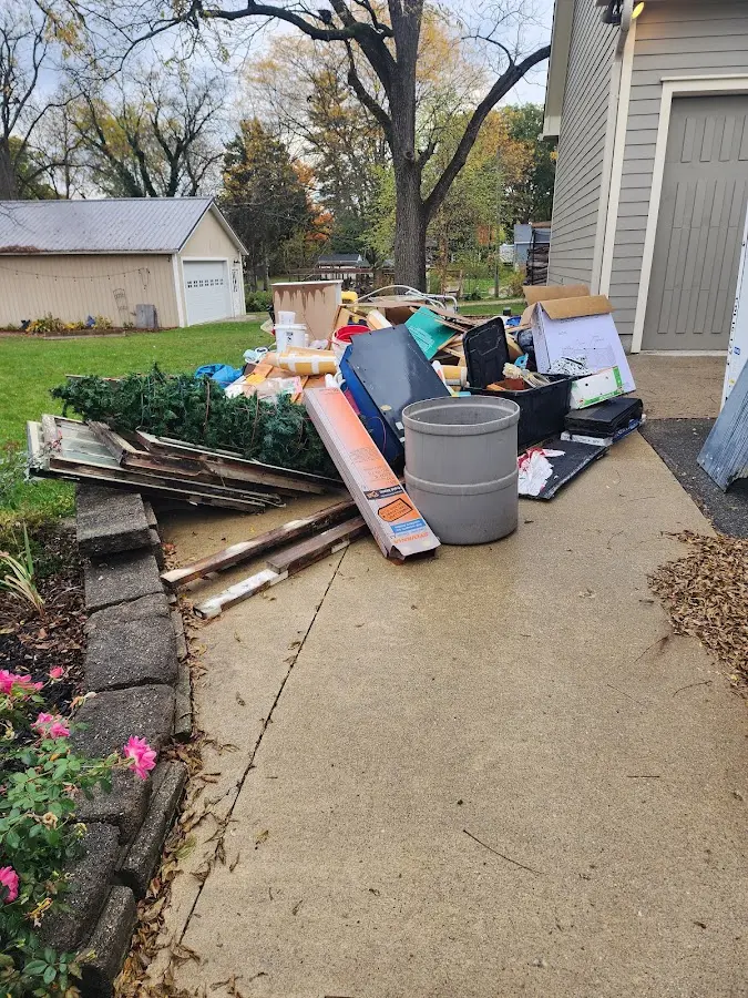 Dumpster being loaded with debris for 10 Yard Dumpster Rental in Brown Station
